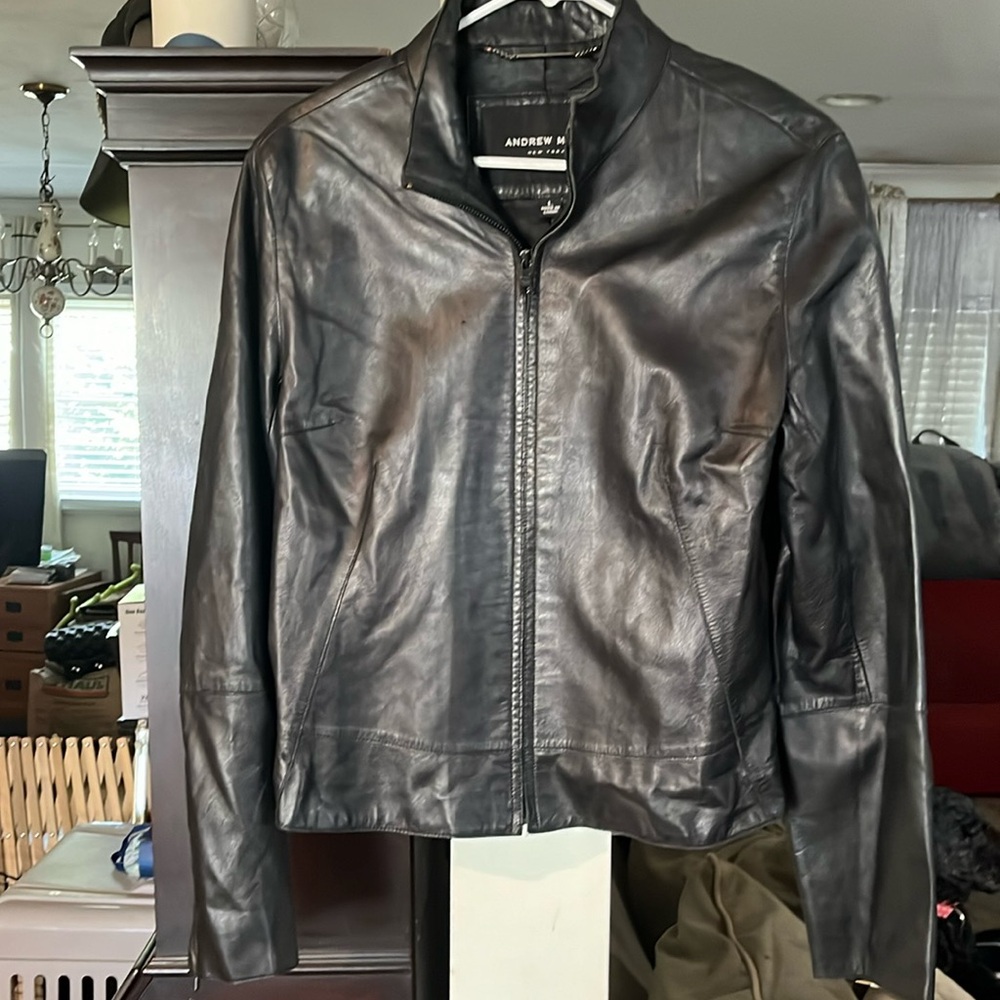 Andrew Marc black leather jacket size large. Good condition all zippers work.